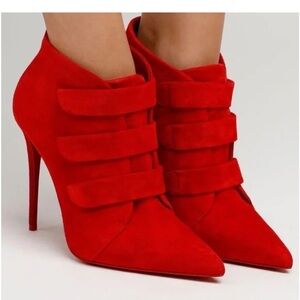 Red Louboutin boots